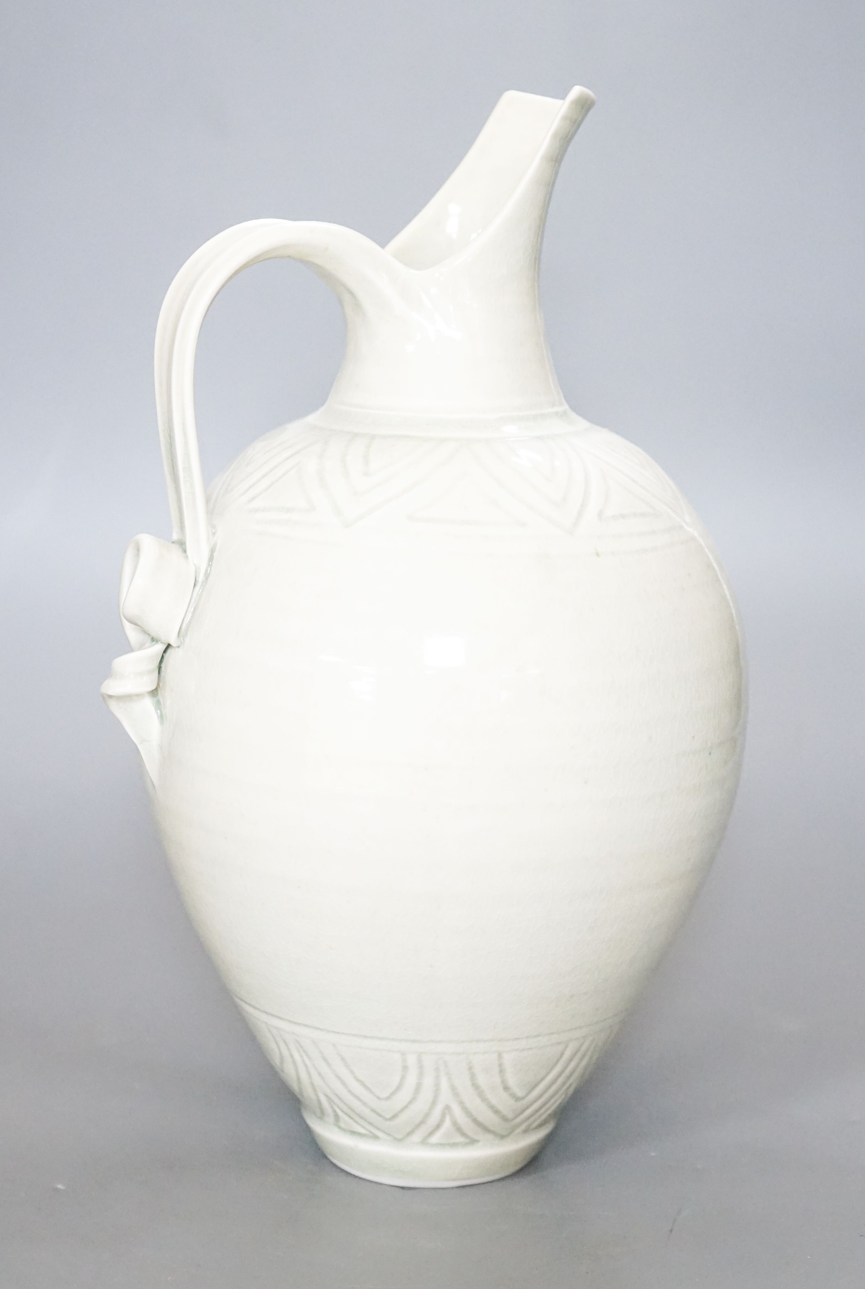 Bridget Drakeford (b.1946), a celadon glazed porcelain jug 30cm